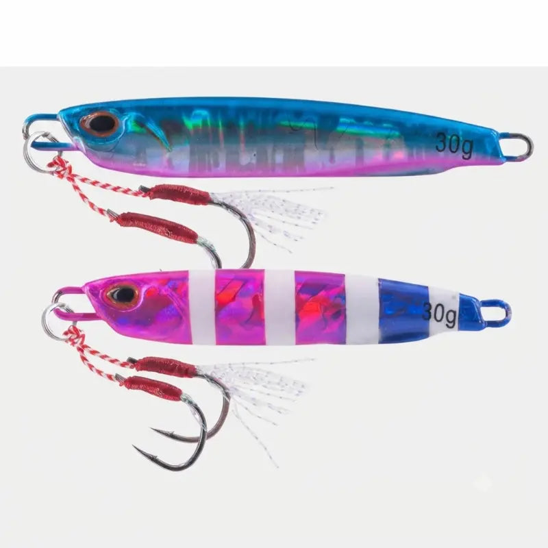 Jigs Jatsui Rush Bash 3g, mostrando as cores 04 (holográfico azul/rosa) e 06 (riscas rosa/branco), com anzóis assist incluídos